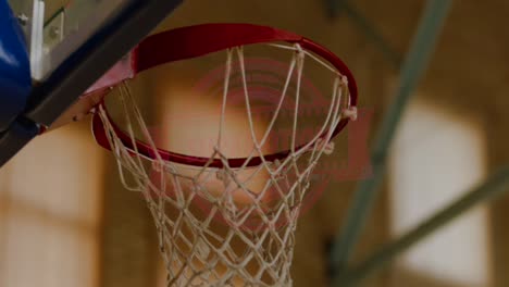 CU-Basketball-going-through-the-basket-at-the-indoor-sports-arena.-4K-UHD-120-FPS-SLO-MO